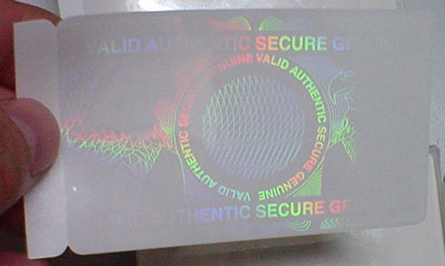 Holographic overlay security feature on novelty ID card